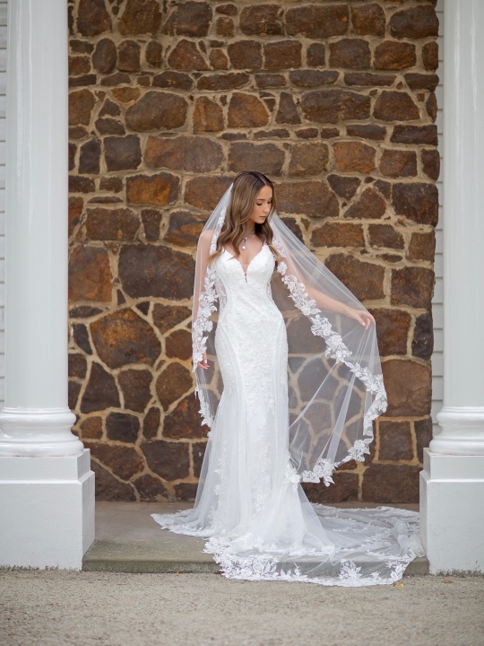 brunette woman in silk white wedding dress